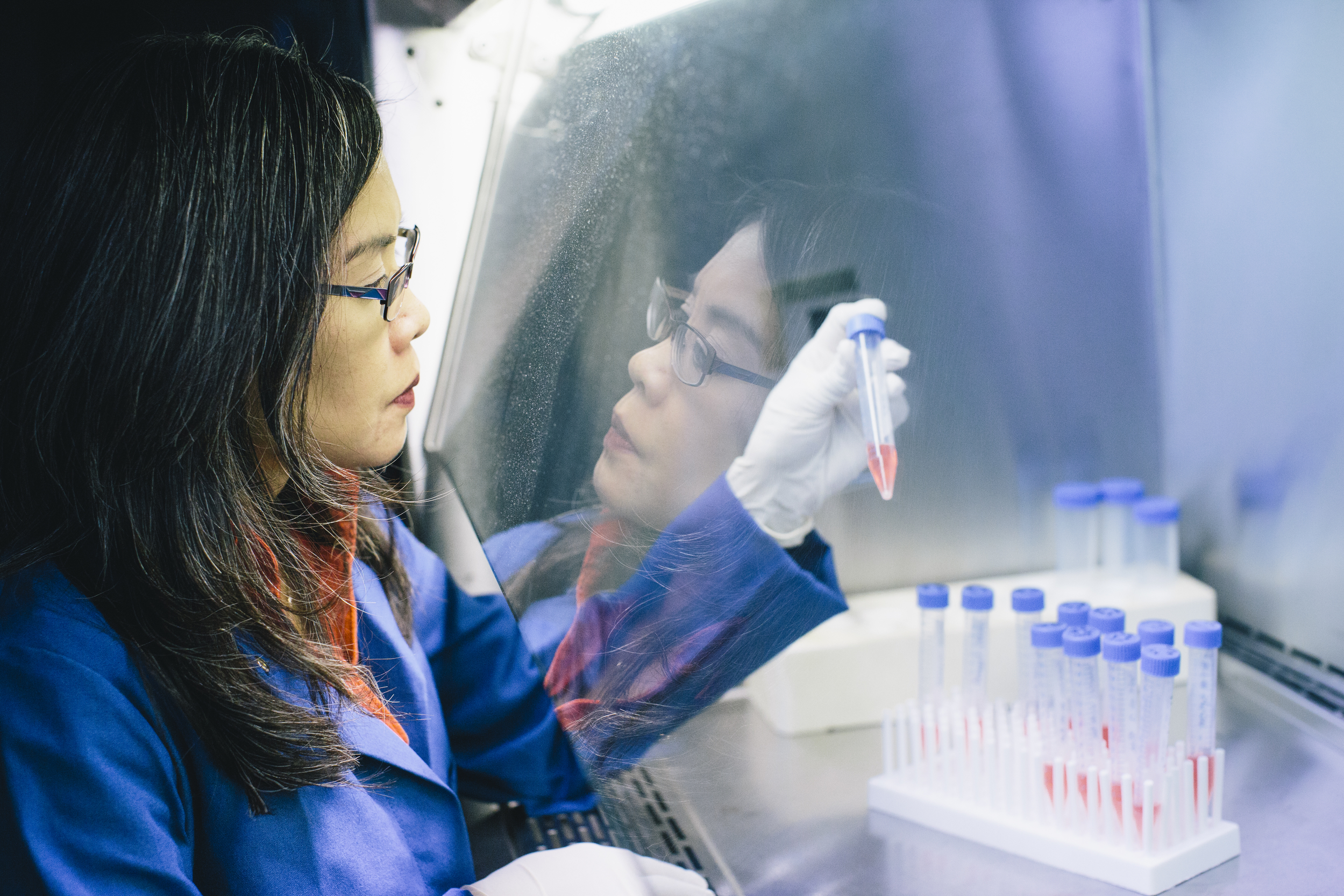 UC Merced researcher working with vials